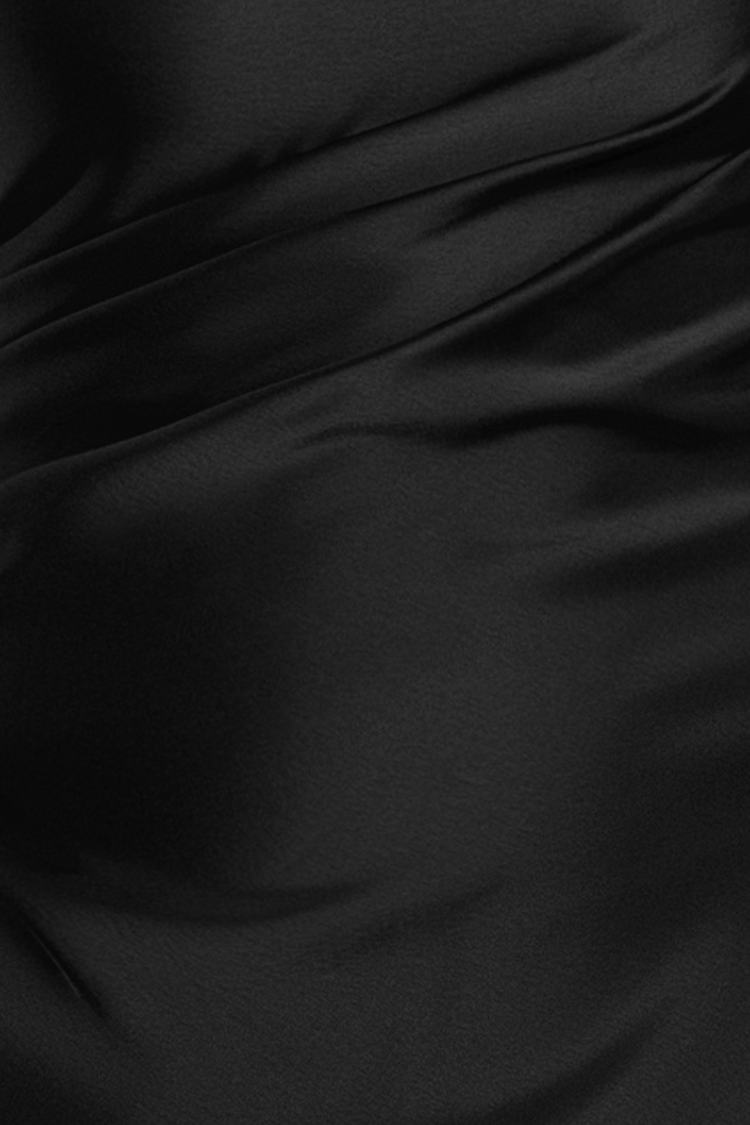 Close-up of the double-face satin fabric on the Magnolia satin one shoulder dress, in black.
