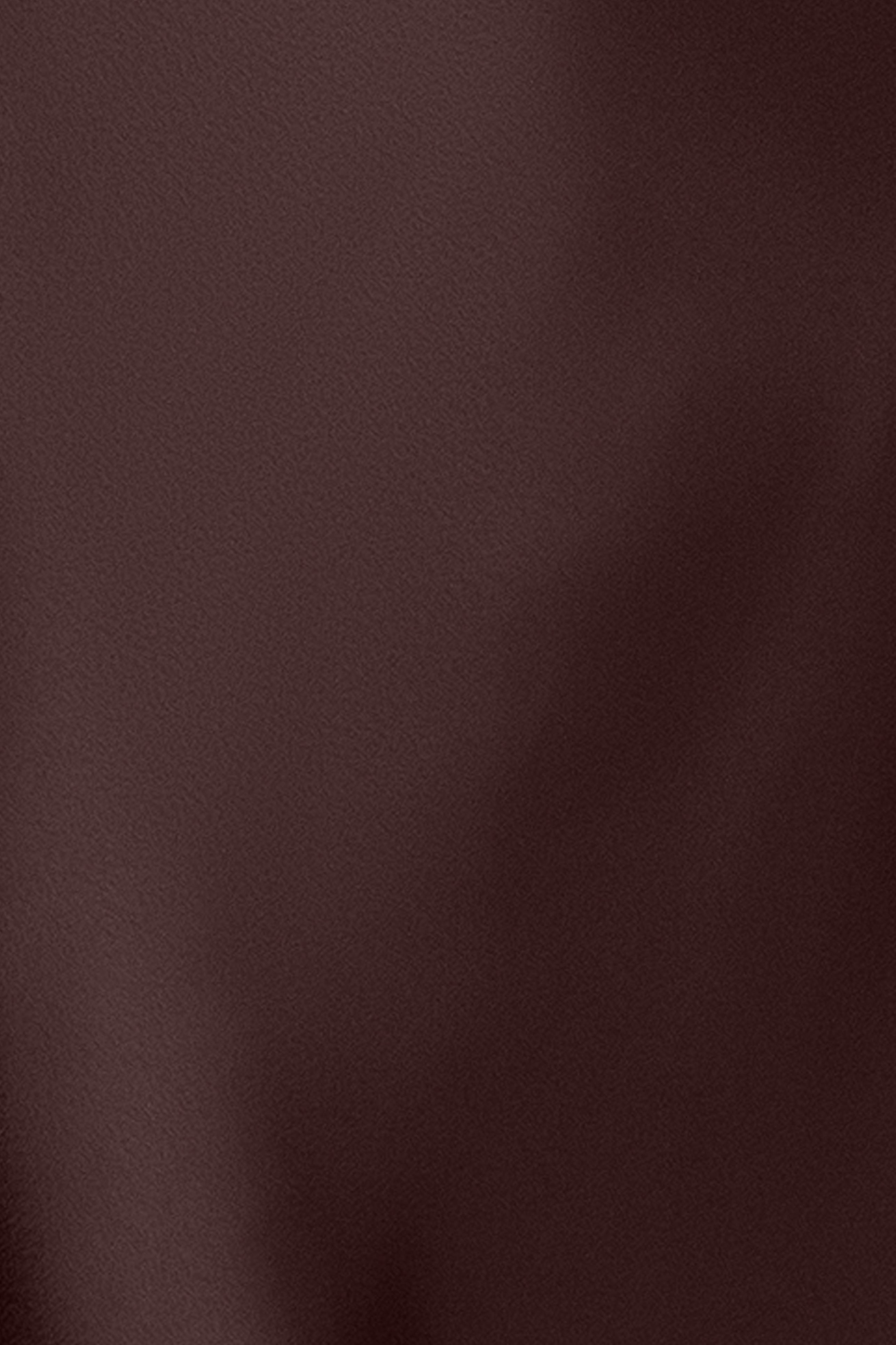Close-up of the double-face satin fabric in brown on the Amberly satin drape neck dress.
