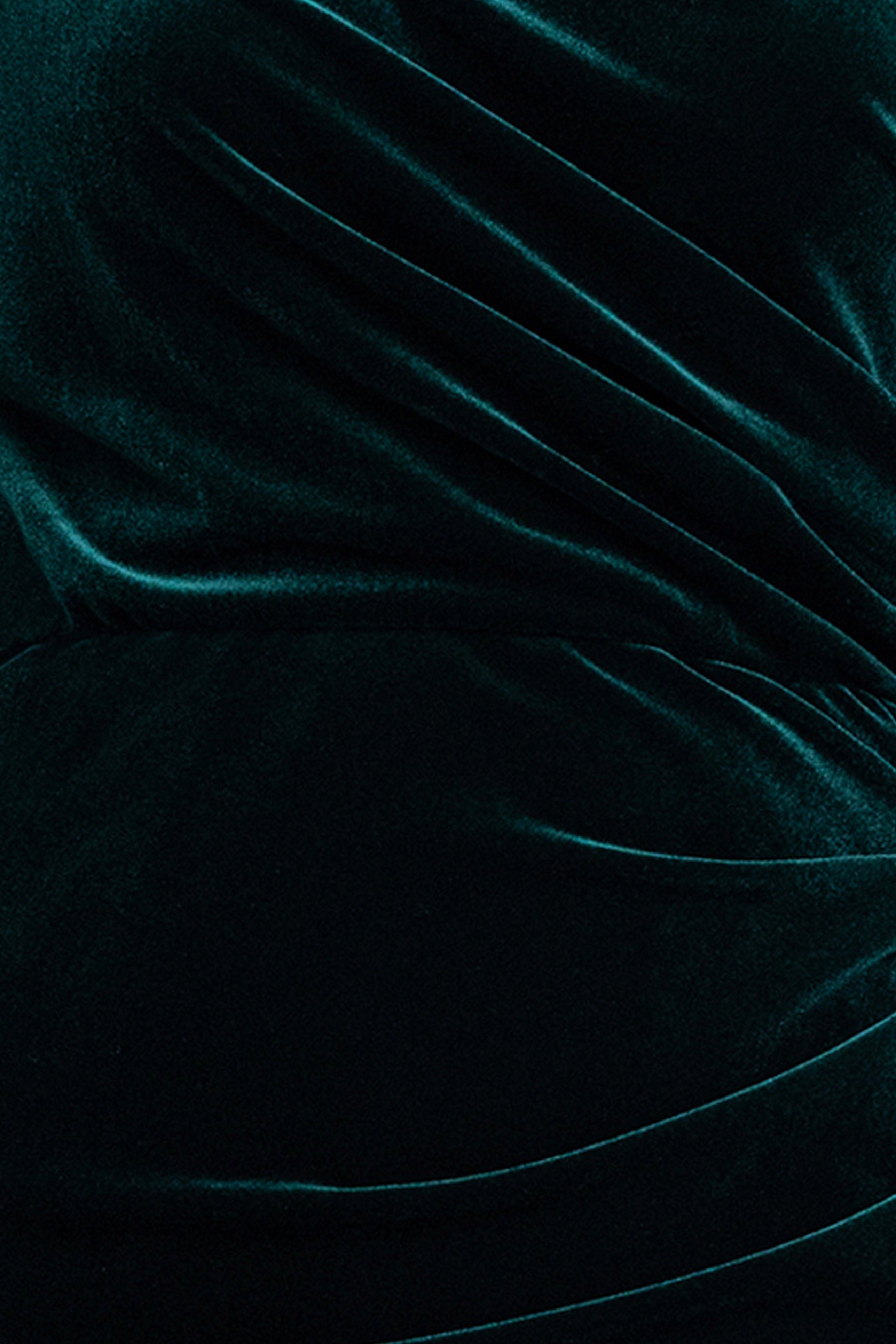 Close-up of the hunter velvet fabric and ruching on the Evie Velvet Off the Shoulder Asymmetrical Dress